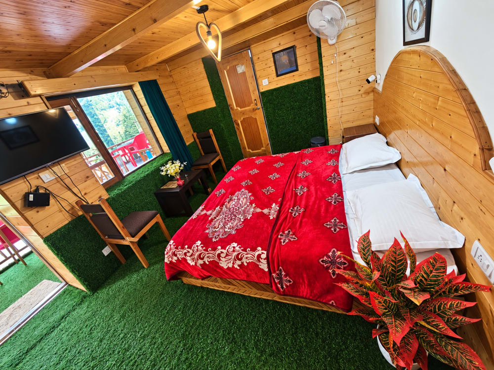 Pine & Pour Deluxe Room with wooden interior and king bed