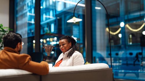 An employee and an HR representative having a private, personal conversation