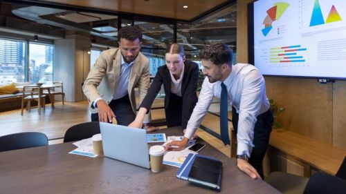 Business People Working On A Laptop Computer In A Modern Office.