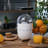 Smeg Retro Citrus Juicer - Matt White with oranges and orange juice