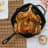 Victoria Seasoned Cast Iron Grill Pan with Helper Handle, 26cm with a full chicken