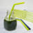 U Konserve Silicone Straws, Pack of 2 in a jar of green juice