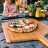 Ooni Bamboo Serving Peel, 30cm with pizza