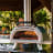 Ooni Ooni Karu Wood & Charcoal Fired Pizza Oven, 40cm in use 