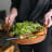 Luuks Kiaat Wooden Tray Bowl with Leather Handles in use