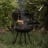 Barebones Cowboy 30 Fire Pit Grill with Adjustable Legs in use