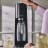 Sodastream Terra Sparkling Water Maker - Black pressing the carbonating button 