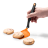 Dreamfarm Mini Chopula Spatula - Orange lifting a cookie