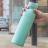 Built Planet Eco Friendly Recycled Water Bottle, 500ml - Green held outdoor