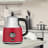 Swan Retro Cordless Kettle with Gauge, 1,7L - Red on the kitchen counter