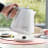 DeLonghi Ballerina Cordless Kettle, 1.7L - Opaline White on the table