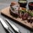 Sagenwolf Carbon Series Steak Knives, Set of 4 on the table with meat