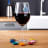 Vacu Vin Classic Wine Glass Markers, Set of 8 on the table with a glass of wine