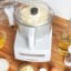 Magimix Compact 1100W Food Processor, 5200XL - White on the table