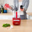 Magimix Le Mini Plus 1.7L Food Processor - Red on the table