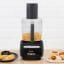 Magimix Le Mini Plus 1.7L Food Processor - Black on the table