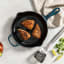 Le Creuset Signature Round Cast Iron Skillet, 26cm - Agave with meat on the table