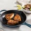 Le Creuset Signature Round Cast Iron Skillet, 26cm - Agave with meat on the table