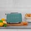 Smeg Retro 2-Slice Toaster, 950W - Matte Emerald Green on the kitchen counter