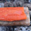 Jimmy Public Salt Slab with salmon on hot coal