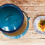 LK's Enamel Size 3 Potjie Pot - Blue top view with a plate of food