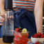 BIBO Fizz Bar Sparkling Drink Maker - Black on the table with a strawberry cocktail 