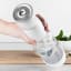 Action image of BIBO Fizz Go Handheld Sparkling Water Maker