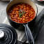 Le Creuset Signature Cast Iron Saucepan with Lid, 18cm with food