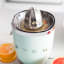 Smeg Electric Citrus Press in use