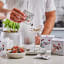 Secco Mixed Box Drink Infusion, Pack of 8 on the table with a cocktail glass