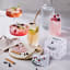 Secco Mixed Box Drink Infusion, Pack of 8 on the table with cocktail glasses