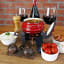 LK's Mini Potjie Cooker Stand, Set of 2 on the table with food