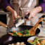 Microplane Gourmet Coarse Grater in use over pan of vegetables 