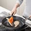 Joseph Joseph Turner Tongs being used in a pan flipping food