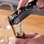 Vacu Vin Single Pull Corkscrew with a bottle of wine on the table