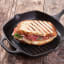 Victoria Seasoned Cast Iron Grill Pan with Helper Handle, 26cm with a sandwich