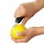 Action image of OXO Good Grips Citrus Zester with Channel Knife
