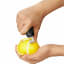 Action image of OXO Good Grips Citrus Zester with Channel Knife