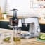 Kenwood Chef & Chef XL Slow Press Juicer Attachment with apples and apple juice.