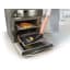 NoStik Reusable Oven Protector, in oven with melted cheese from pizza
