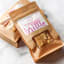The Counter Salted Macadamia & Rosemary Brittle, 120g on the table