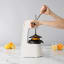 Action image of Chef'n FreshForce Tabletop Citrus Press