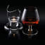 KitchenCraft BarCraft Brandy Glass Warmer Set in use in a dark setting