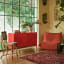 Popstrukt Sugar Cube Media Unit - Red Polka with decorative books and vases