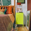 Popstrukt Sugar Cube Side Table - Cyber Lime next to the bed