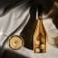 Armand de Brignac Brut Gold Champagne, 750ml with a glass