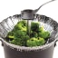 Lifestyle image of OXO Good Grips Stainless Steel Steamer Basket with Extendable Handle