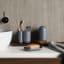 Umbra Touch Toothbrush Holder - Slate Blue  next to a basin