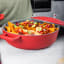 MasterClass Cast Aluminium 4L Shallow Casserole Dish, 28cm - Red on the kitchen counter with food