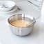 Brabantia Matt Steel Mixing Bowl - 1L on the table with a mixed yoghurt paste